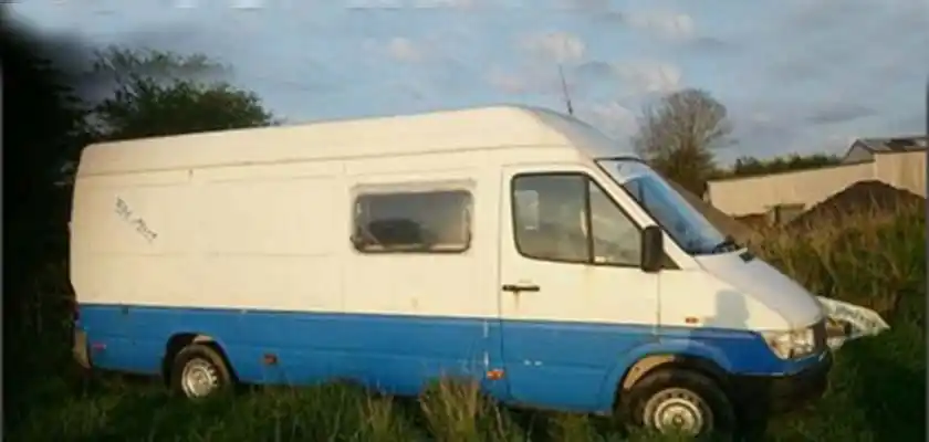A blue and white van