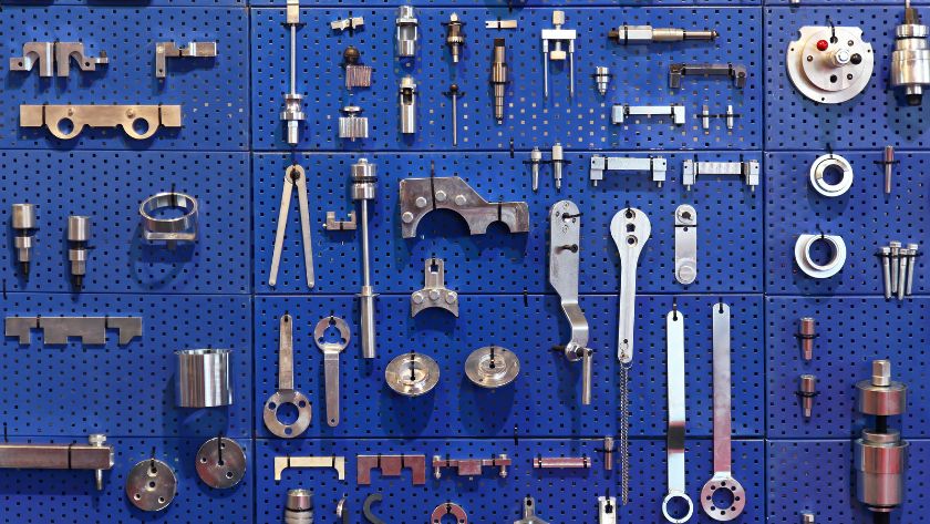tools organised on a side panel in a work van